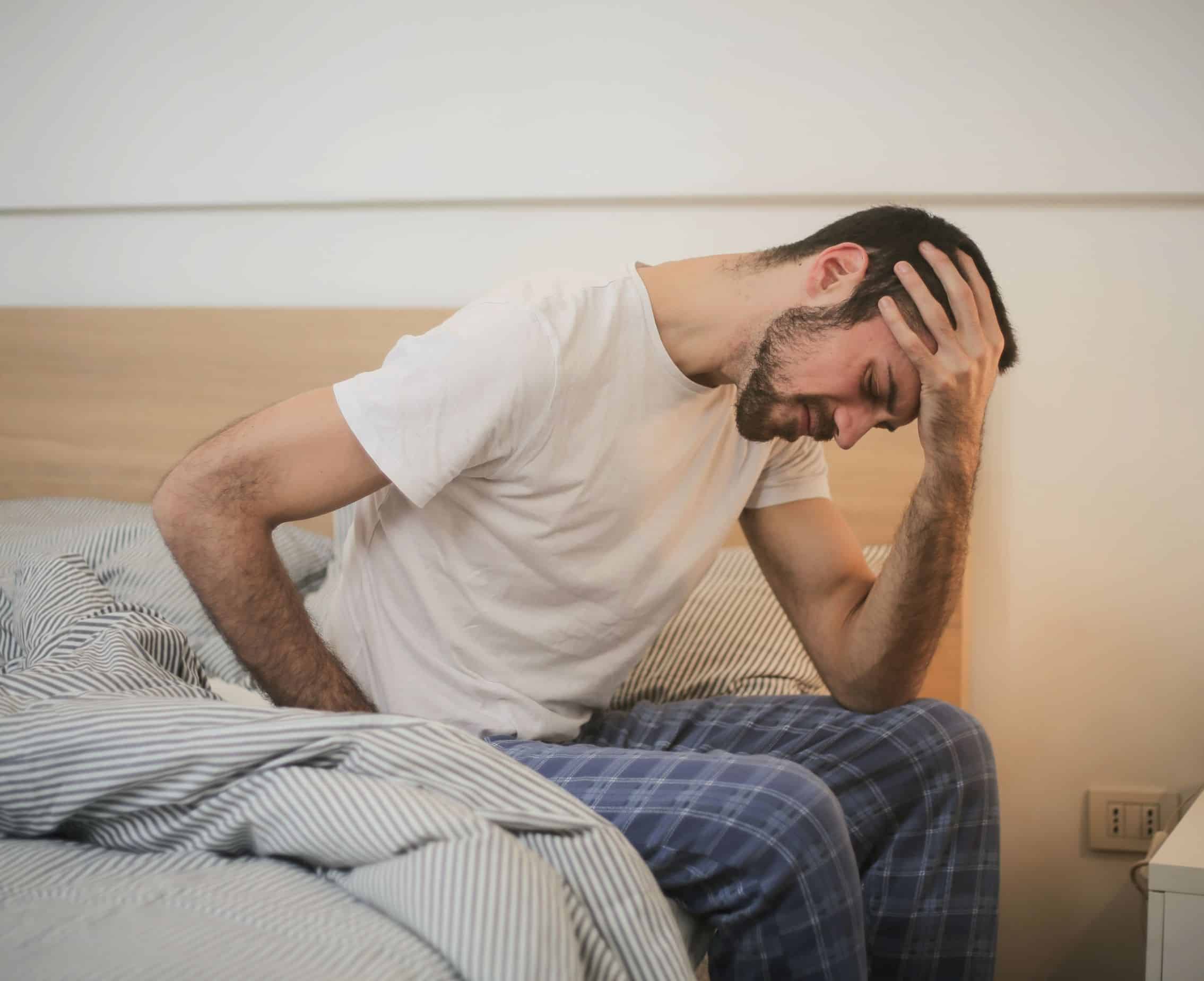 Long COVID functional medicine treatment Picture of a man with long COVID and experiencing fatigue, weakness, shortness of breath and headaches.